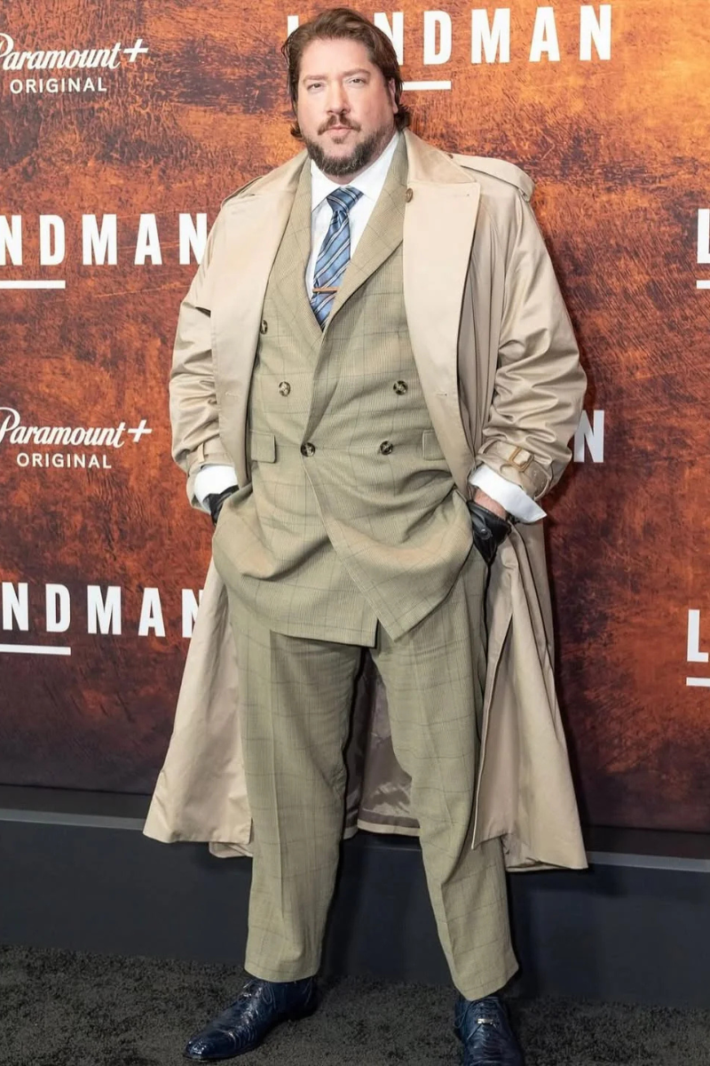 Tanner Beard wears a custom 2 piece suit and custom trench