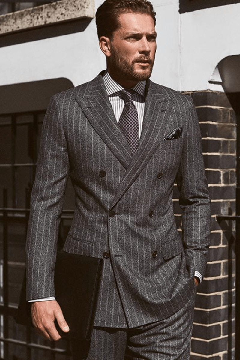 Man in a charcoal double-breasted pinstripe suit