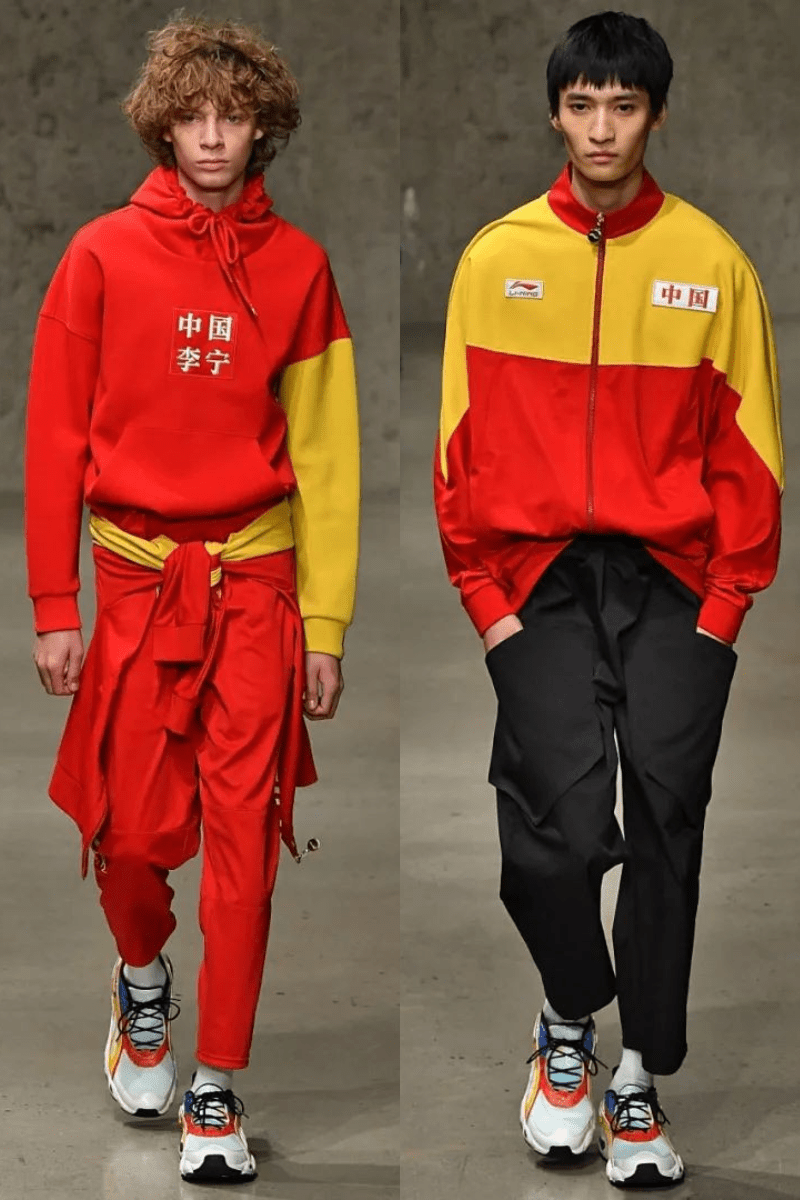 Models in Li-Ning's red and yellow color-blocked runway designs