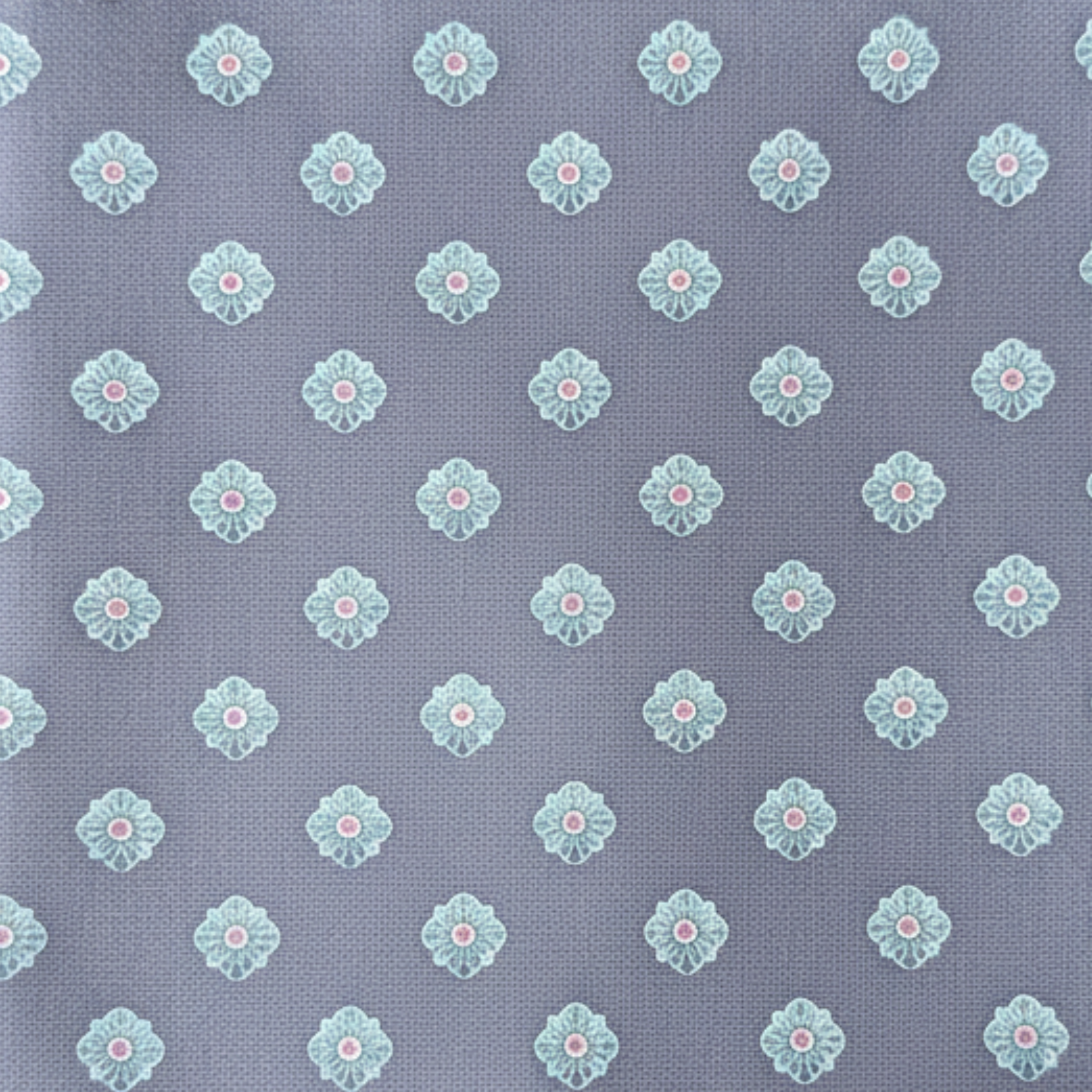 Close-up fabric swatch of blue patterned woven silk tie texture and motif