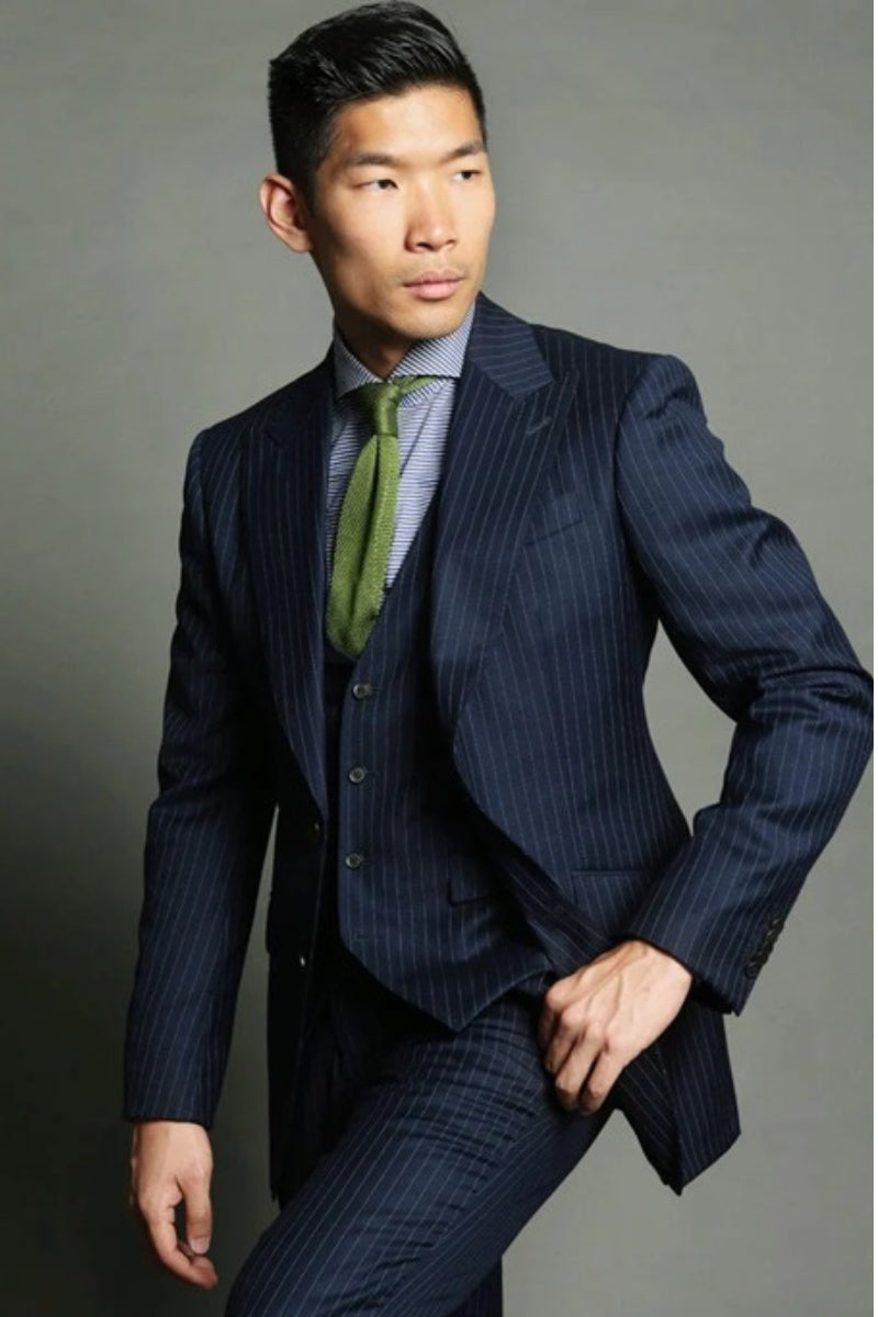 Model in bespoke navy suit
