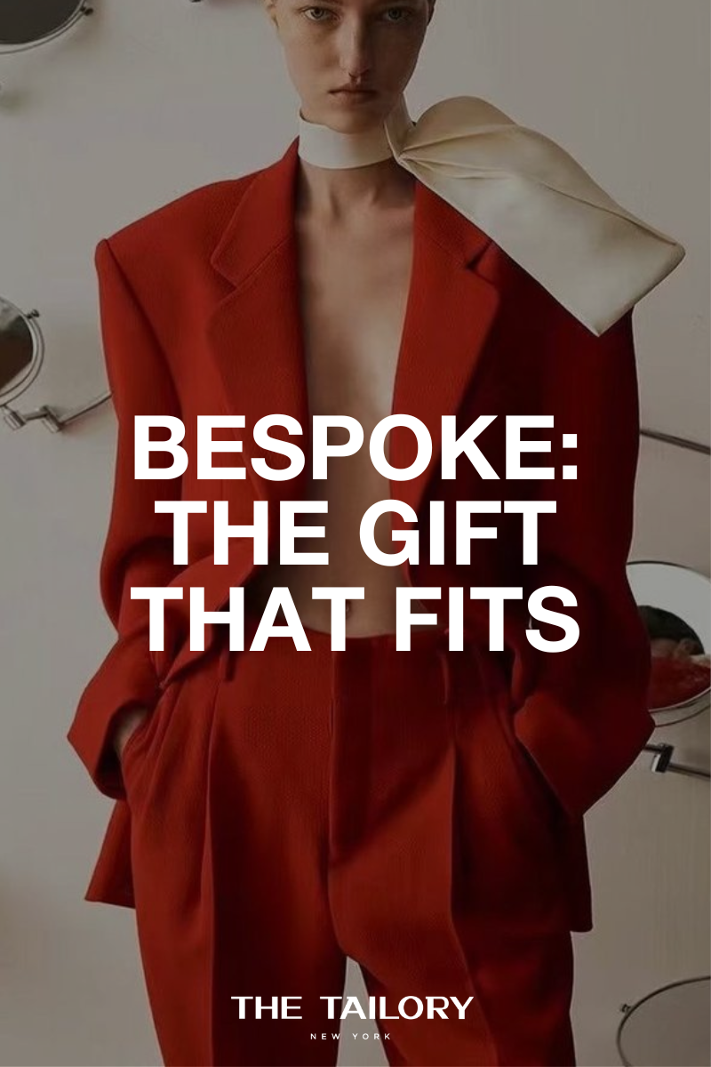 Model wearing a red tailored suit with Bespoke: The Gift That Fits text overlay.