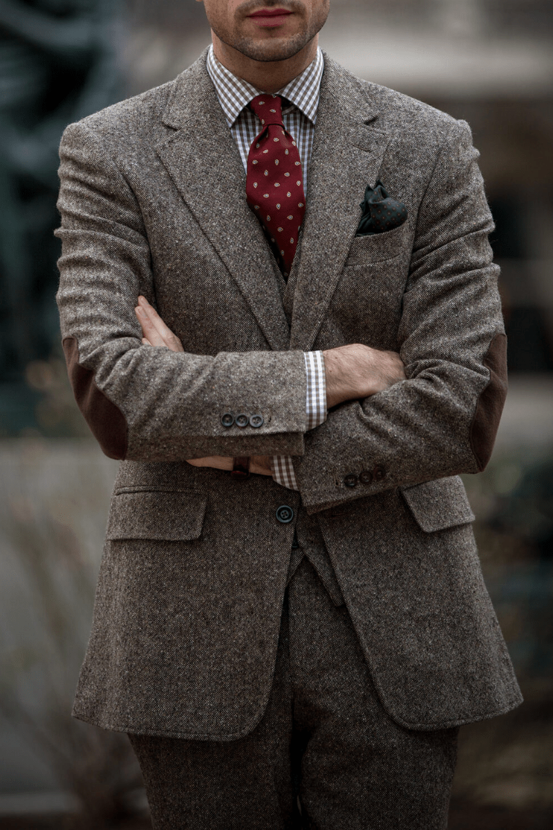 A model in a gray bespoke jacket