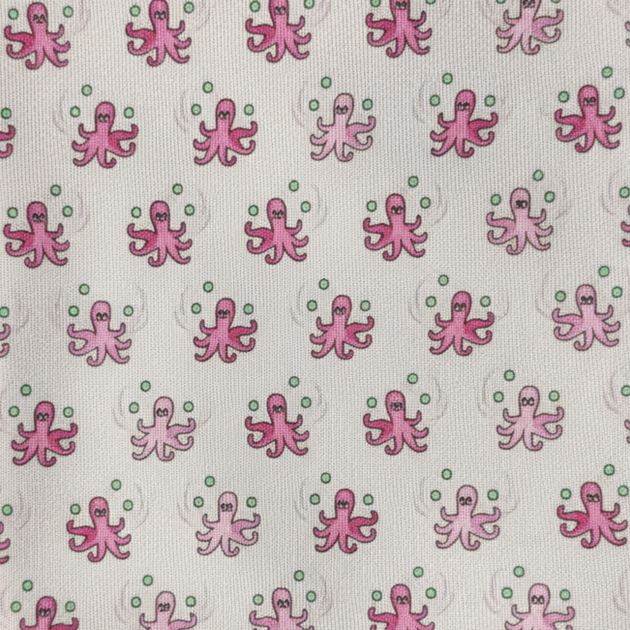 Close-up fabric swatch of pink octopus motif woven silk tie with green accents