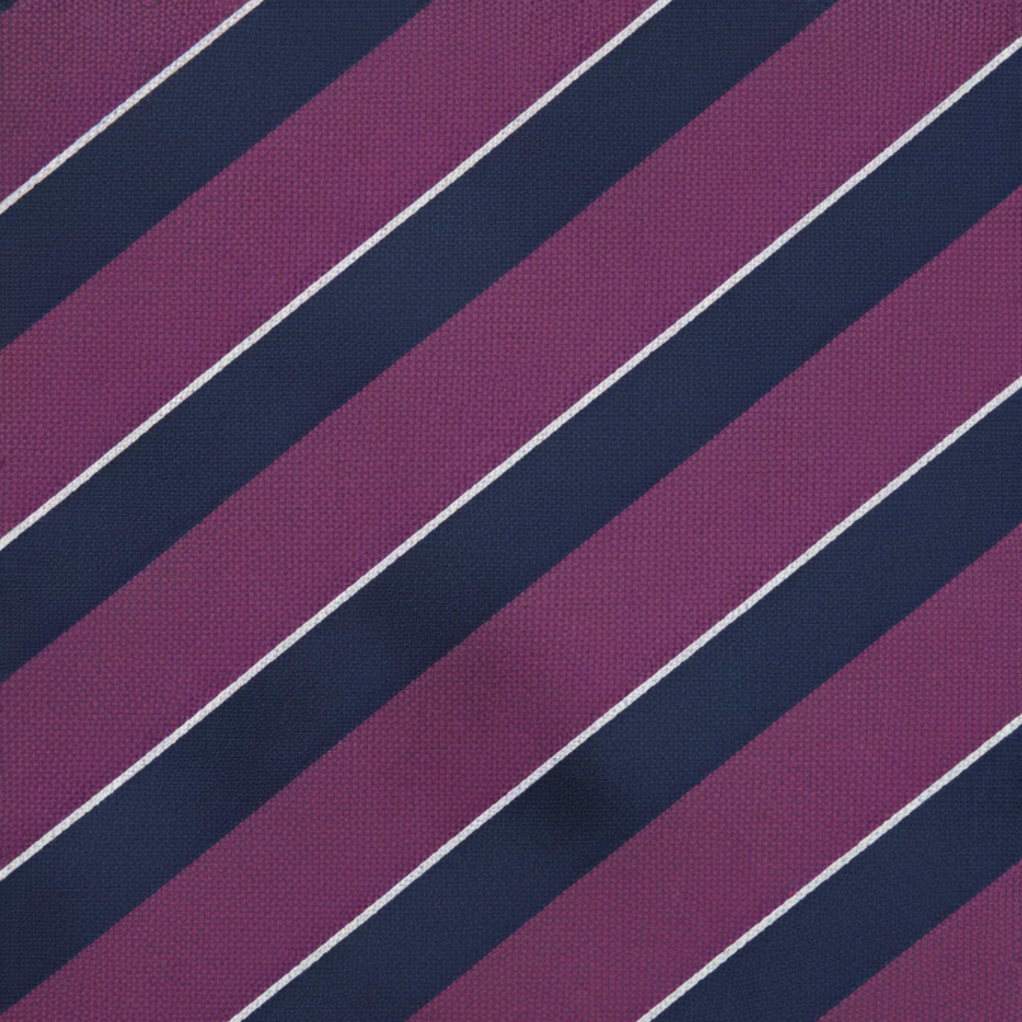 Close-up of striped silk tie fabric showing diagonal weave and color detail